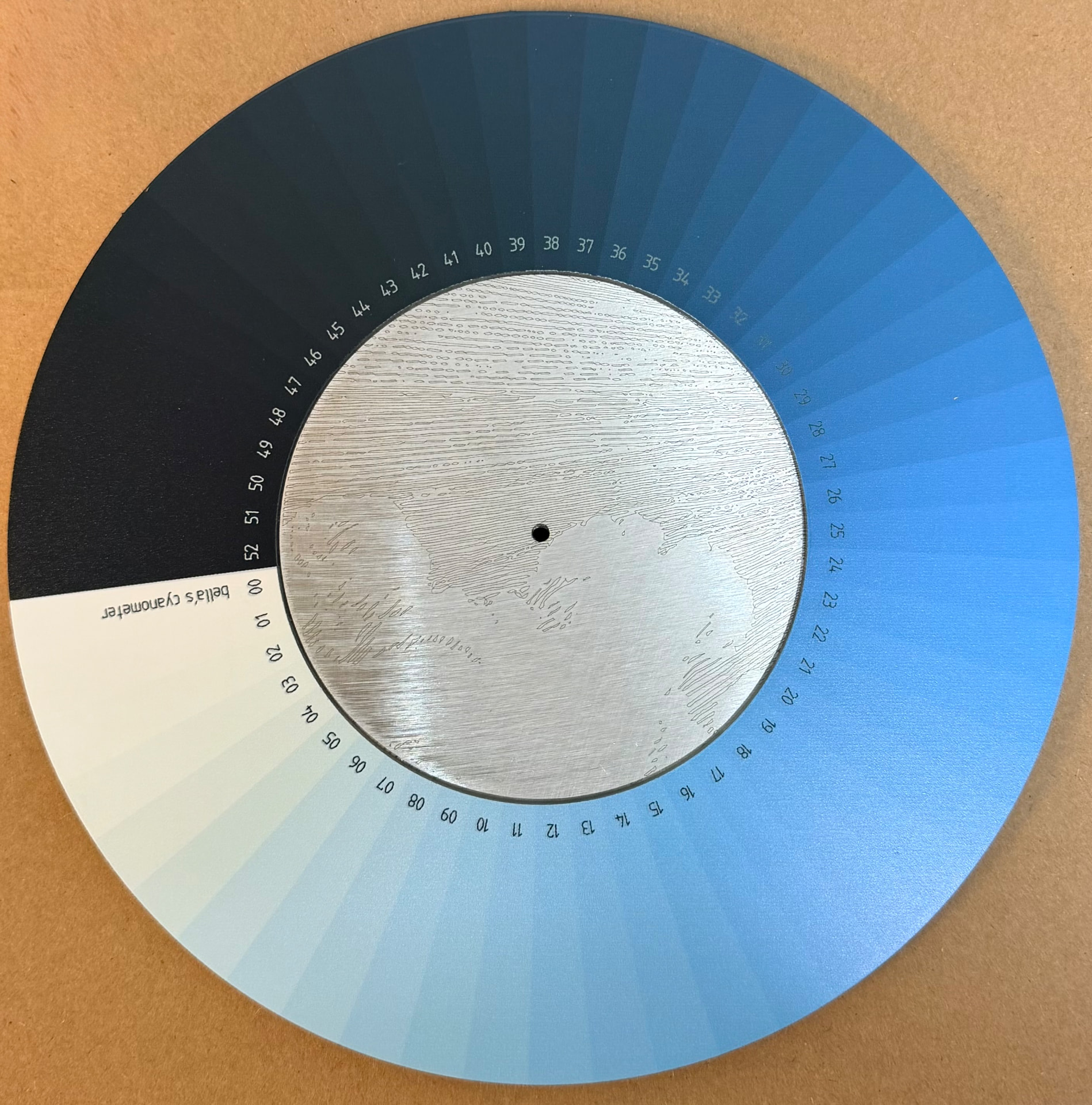 Bella's Cyanometer — sky-blue color wheel UV printed on the front of an aluminum disc